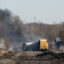 Smoke rises from a derailed cargo train in East Palestine, Ohio, on February 4, 2023. The train accident sparked a massive fire and evacuation orders, officials and reports said Saturday. Credit: Dustin Franz/AFP via Getty Images